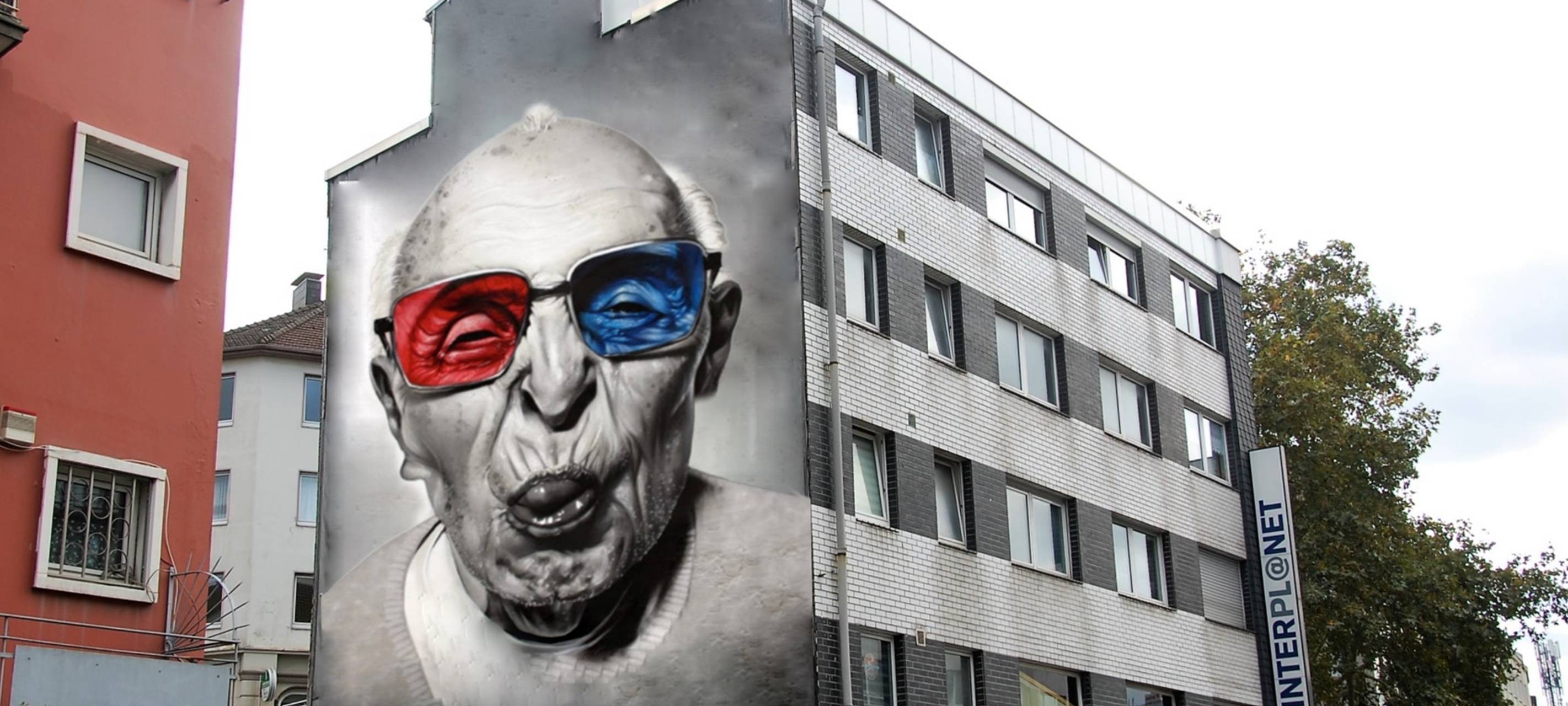 Laien malen Bilder auf Hausfassaden