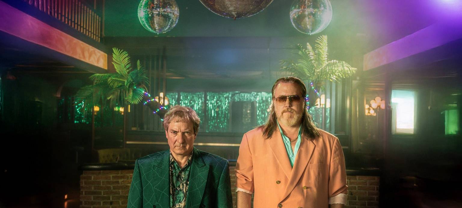 Gerri und Richard sind die Drahtzieher hinter der Zeitreise.