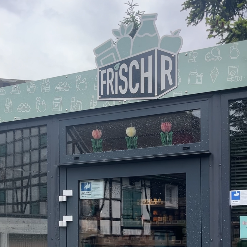 Das Schild vom Lebensmittelcontainer FrischR